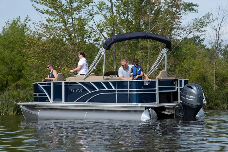 Slide: The Image of Manufacturer Provided Image: 2026 Sylvan Mirage Fish 8520 Party Fish 4.0 pontoon boat on a serene lake. - 3