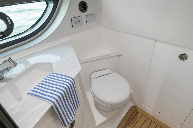 Slide: The Image of Luxurious bathroom in 2026 Hurricane SunDeck 3200 OB boat with modern fixtures. - 15