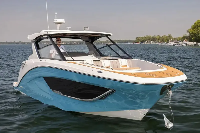 Slide: The Image of Manufacturer Provided Image: 2026 Hurricane SunDeck 3200 OB boat on a calm lake, featuring sleek design and modern amenities. - 2