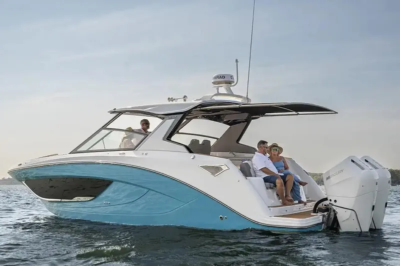 Slide: The Image of Manufacturer Provided Image: 2026 Hurricane SunDeck 3200 OB boat on water, featuring sleek design and modern amenities. - 3