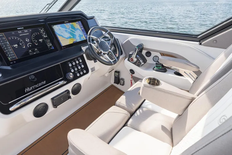 Slide: The Image of Interior cockpit of 2026 Hurricane SunDeck 3200 OB with advanced navigation displays. - 9