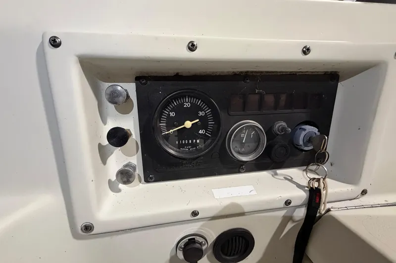 Slide: The Image of Dashboard of a 1985 C&C 35 MK III sailboat with gauges and ignition keys. - 10