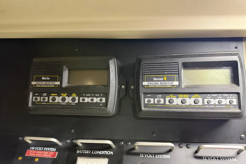 Slide: The Image of Vintage sailing monitors on a 1985 C&C 35 MK III yacht dashboard. - 23