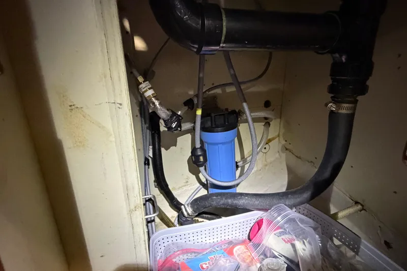 Slide: The Image of Under-sink plumbing with blue filter in 1985 C&C 35 MK III sailboat. - 30