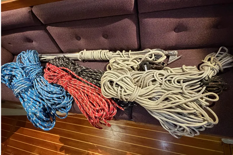 Slide: The Image of Coiled ropes in various colors on a boat's wooden floor, C&C 35 MK III, 1985. - 32