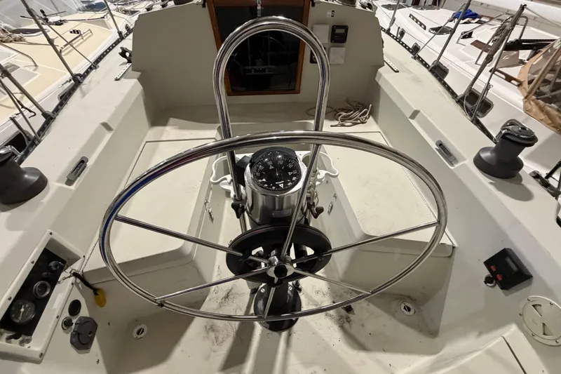 Slide: The Image of Cockpit of 1985 C&C 35 MK III sailboat with steering wheel and compass. - 6