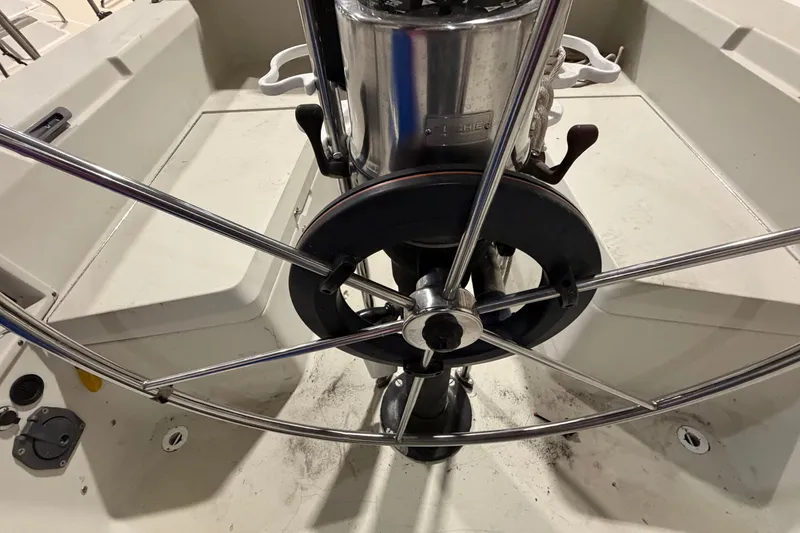 Slide: The Image of Steering wheel of a 1985 C&C 35 MK III sailboat, featuring stainless steel design. - 7