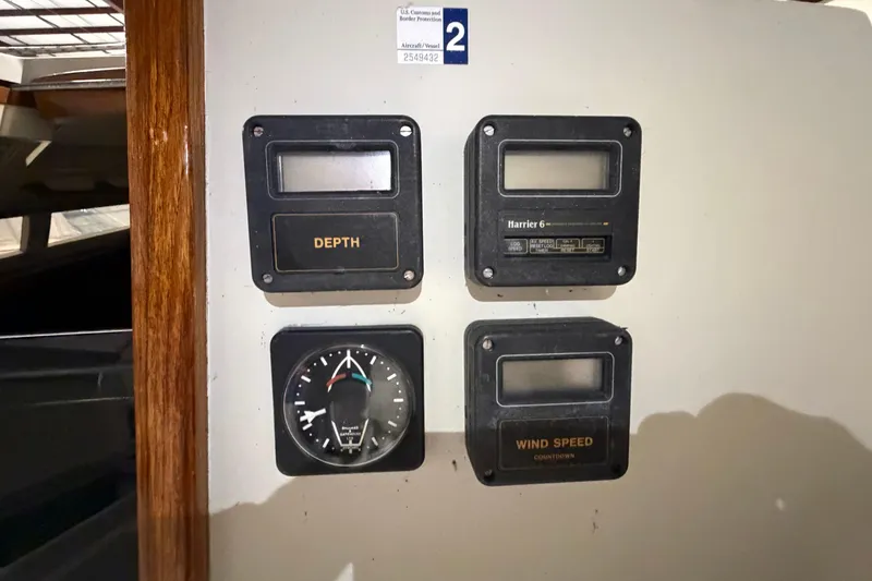 Slide: The Image of Control panel on a 1985 C&C 35 MK III sailboat with depth and wind speed gauges. - 9