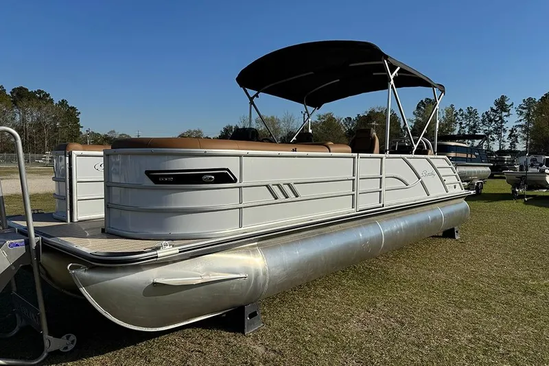 The Image of 2026 Bentley Pontoons 253 Elite Swingback DC on grass, featuring sleek design and canopy. - 1