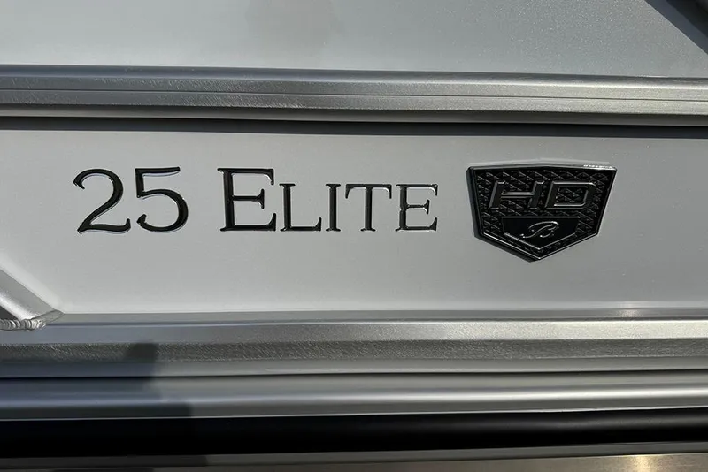 Slide: The Image of Close-up of 2026 Bentley Pontoons 253 Elite Swingback DC logo and emblem. - 11