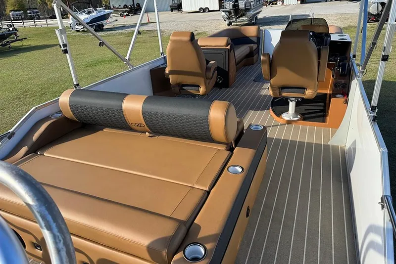 Slide: The Image of 2026 Bentley Pontoons 253 Elite Swingback DC interior with luxurious tan seating and modern design. - 13