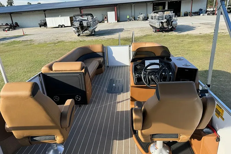 Slide: The Image of 2026 Bentley Pontoons 253 Elite Swingback DC interior with luxurious seating and modern dashboard. - 14