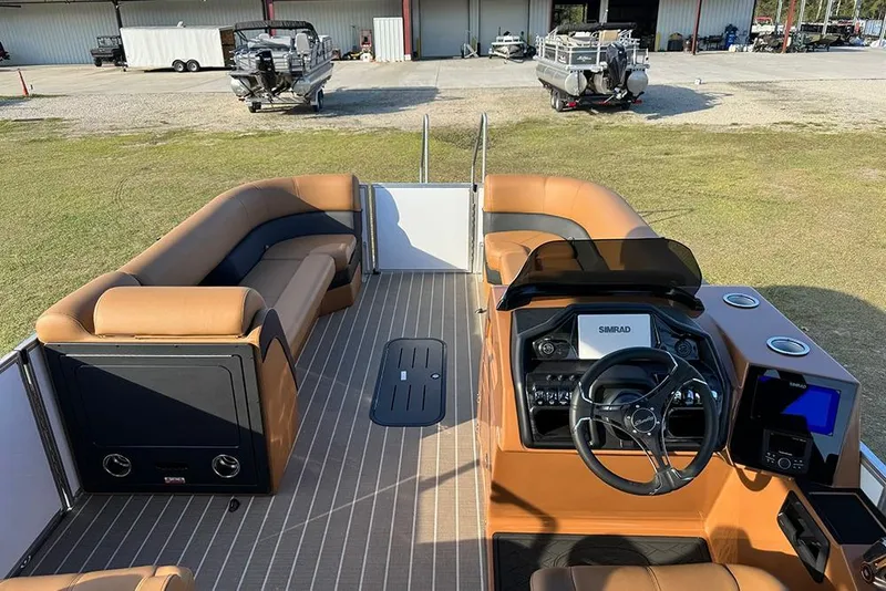 Slide: The Image of 2026 Bentley Pontoons 253 Elite Swingback DC interior with luxurious seating and modern dashboard. - 15