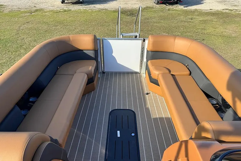 Slide: The Image of 2026 Bentley Pontoons 253 Elite Swingback DC interior with tan and black seating. - 16