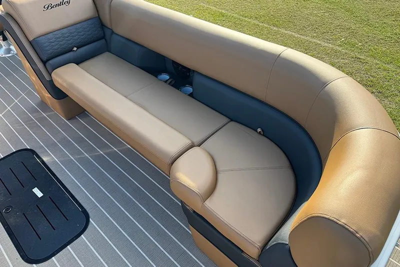 Slide: The Image of Luxurious seating on 2026 Bentley Pontoons 253 Elite Swingback DC, featuring tan upholstery. - 17