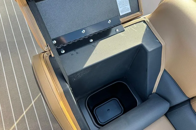 Slide: The Image of Open storage compartment in 2026 Bentley Pontoons 253 Elite Swingback DC boat. - 19