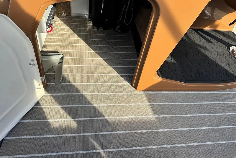 Slide: The Image of Interior flooring of 2026 Bentley Pontoons 253 Elite Swingback DC, featuring striped design. - 26