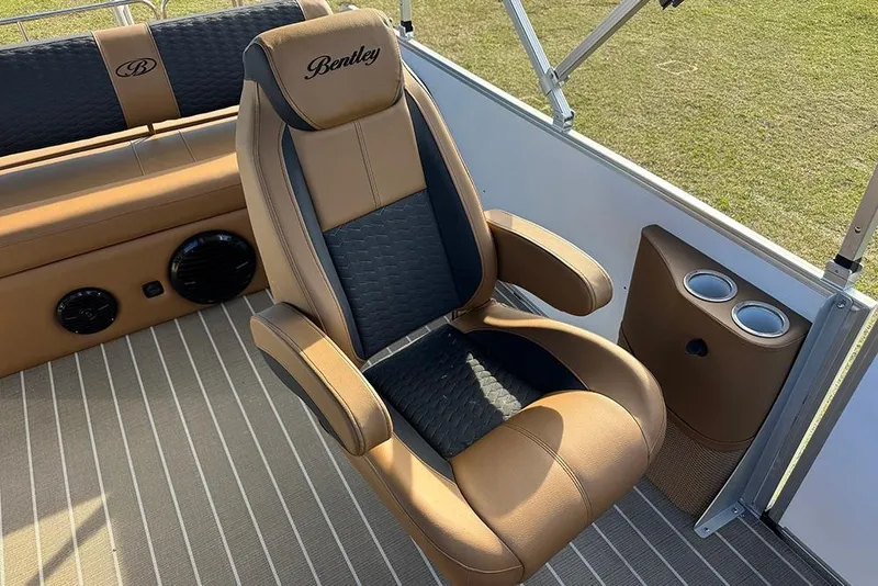 Slide: The Image of Luxurious seating on 2026 Bentley Pontoons 253 Elite Swingback DC with cup holders. - 28