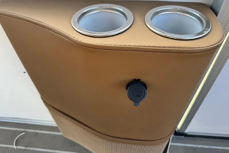Slide: The Image of Cup holders and USB port on 2026 Bentley Pontoons 253 Elite Swingback DC. - 29