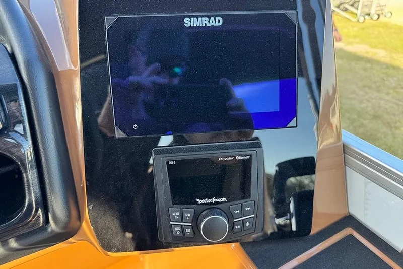 Slide: The Image of Simrad display and Rockford Fosgate audio system on 2026 Bentley Pontoons 253 Elite Swingback DC. - 35