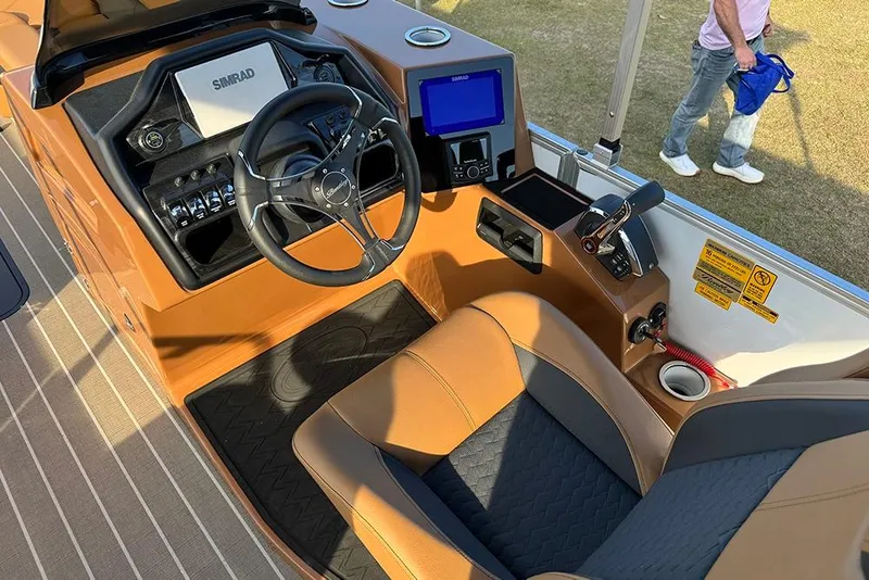 Slide: The Image of Interior of 2026 Bentley Pontoons 253 Elite Swingback DC with steering wheel and controls. - 37