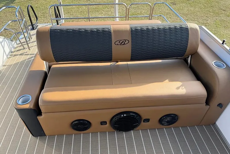 Slide: The Image of 2026 Bentley Pontoons 253 Elite Swingback DC, luxurious seating with integrated speakers. - 38