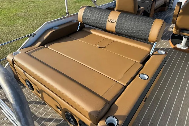 Slide: The Image of 2026 Bentley Pontoons 253 Elite Swingback DC with luxurious tan seating and cup holders. - 41