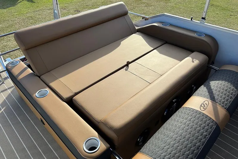 Slide: The Image of 2026 Bentley Pontoons 253 Elite Swingback DC with luxurious tan seating and cup holders. - 43