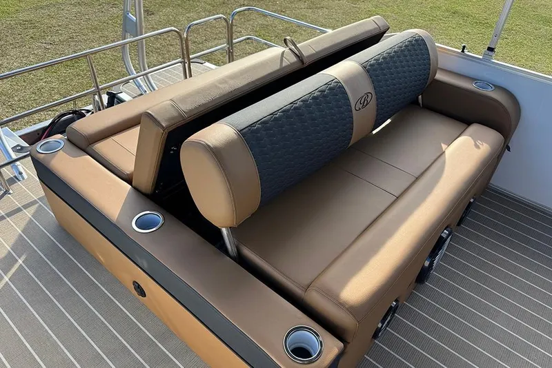 Slide: The Image of 2026 Bentley Pontoons 253 Elite Swingback DC with luxurious tan seating and cup holders. - 45