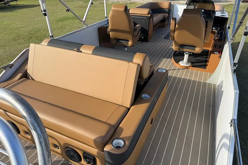 Slide: The Image of 2026 Bentley Pontoons 253 Elite Swingback DC interior with tan seating and modern design. - 46