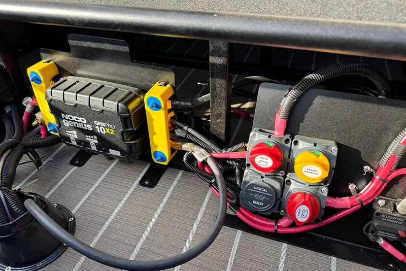 Slide: The Image of Electrical system of 2026 Bentley Pontoons 253 Elite Swingback DC with NOCO Genius charger. - 48