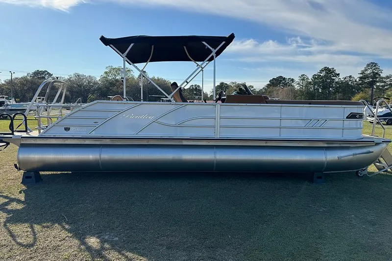 Slide: The Image of 2026 Bentley Pontoons 253 Elite Swingback DC on display, featuring sleek design and canopy. - 7