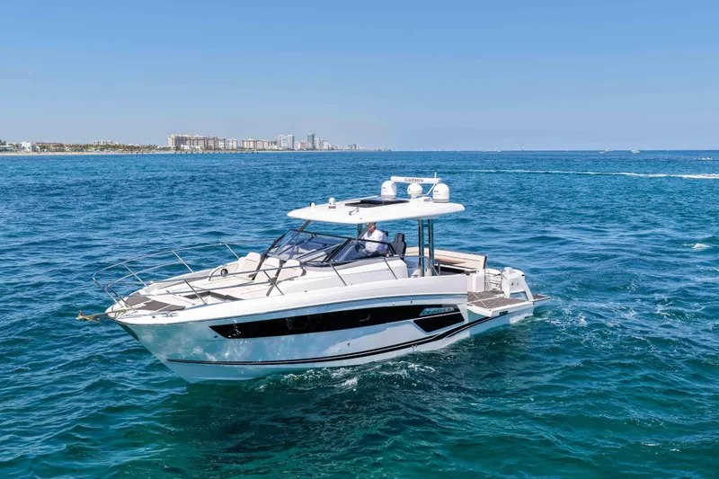 The Image of 2021 Jeanneau Leader 12.5 WA cruising on open blue water. - 0