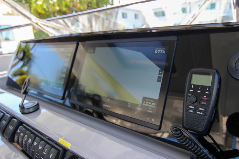 Slide: The Image of 2021 Jeanneau Leader 12.5 WA dashboard with navigation screens and communication device. - 22