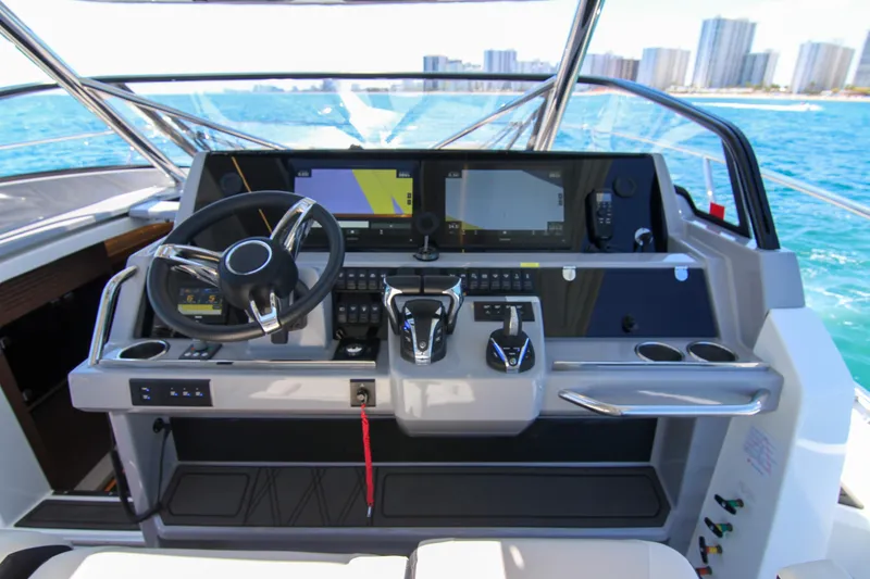 Slide: The Image of Cockpit of 2021 Jeanneau Leader 12.5 WA with modern navigation controls. - 28