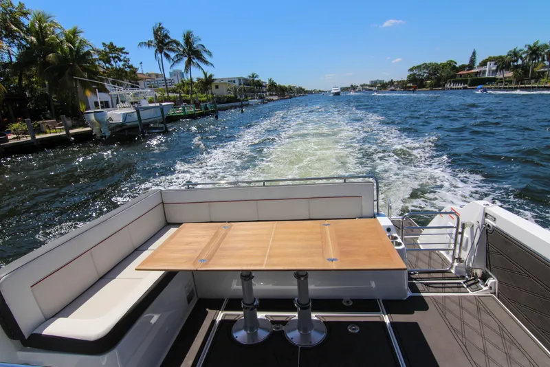 Slide: The Image of 2021 Jeanneau Leader 12.5 WA cruising on a sunny day, featuring a spacious deck. - 33