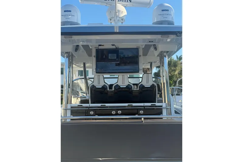Slide: The Image of 2021 Jeanneau Leader 12.5 WA boat interior with seating and navigation equipment. - 36