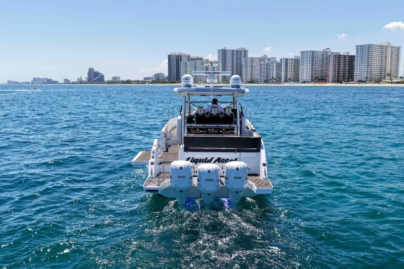 Slide: The Image of 2021 Jeanneau Leader 12.5 WA boat cruising near city skyline on a sunny day. - 4