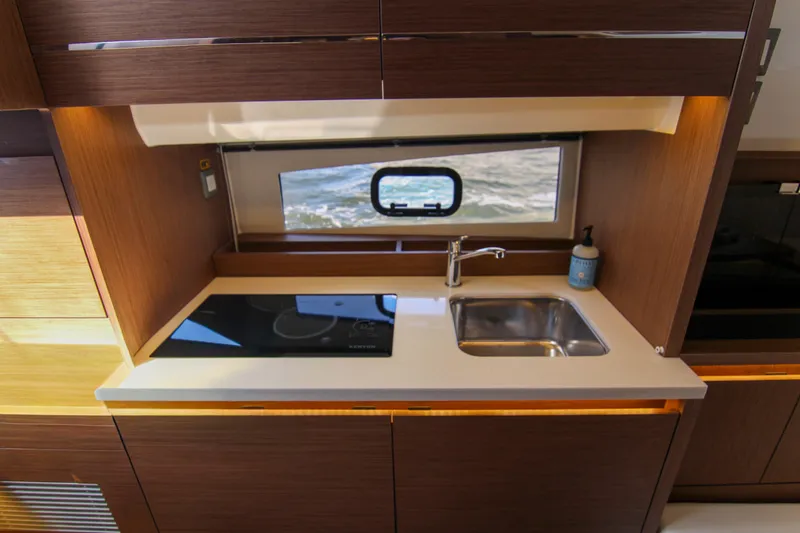 Slide: The Image of Modern kitchen area in 2021 Jeanneau Leader 12.5 WA yacht with sink and cooktop. - 40