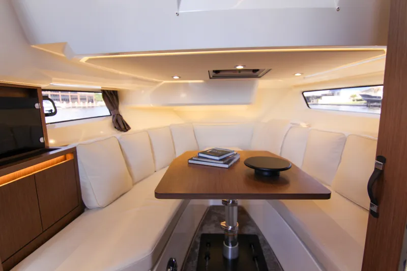 Slide: The Image of Luxurious interior of 2021 Jeanneau Leader 12.5 WA with elegant seating and wooden table. - 42