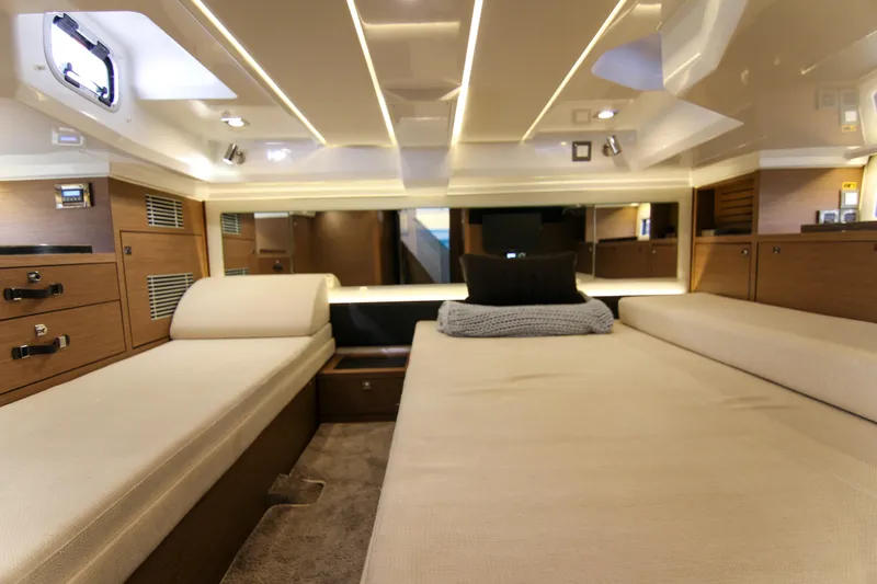 Slide: The Image of Luxurious interior cabin of 2021 Jeanneau Leader 12.5 WA yacht, featuring elegant wood finishes. - 46