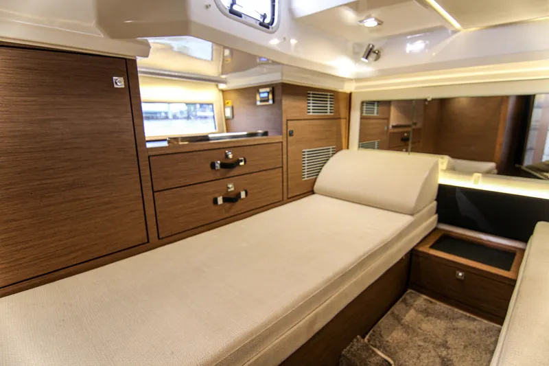 Slide: The Image of Luxurious interior cabin of 2021 Jeanneau Leader 12.5 WA with wood finish and comfortable seating. - 47