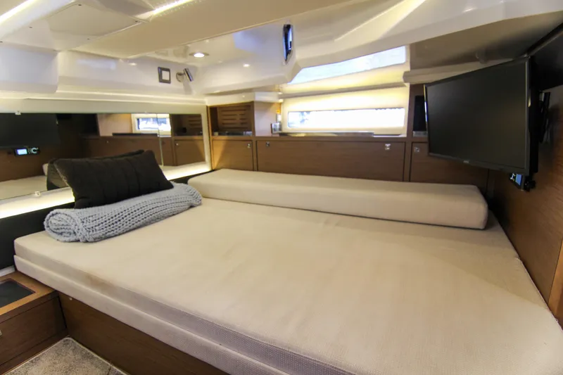 Slide: The Image of Luxurious cabin interior of 2021 Jeanneau Leader 12.5 WA with cozy bedding and modern amenities. - 48