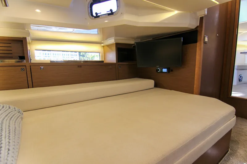 Slide: The Image of Luxurious cabin interior of 2021 Jeanneau Leader 12.5 WA with TV and cozy bed. - 49