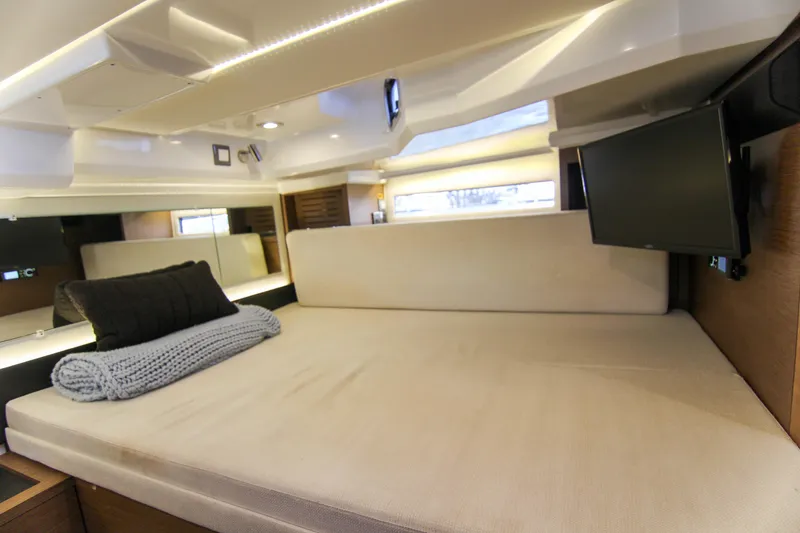 Slide: The Image of Luxurious interior cabin of 2021 Jeanneau Leader 12.5 WA with cozy bedding and TV. - 51