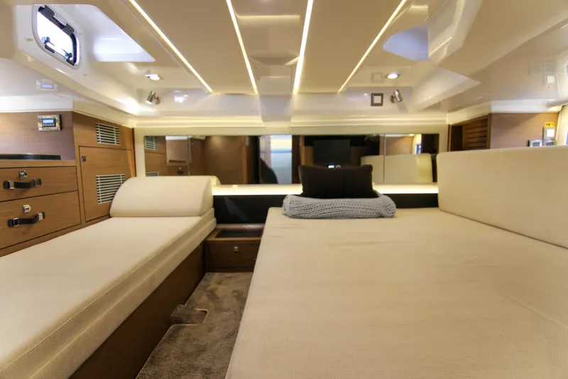 Slide: The Image of Luxurious interior cabin of 2021 Jeanneau Leader 12.5 WA yacht, featuring elegant wood finishes. - 52