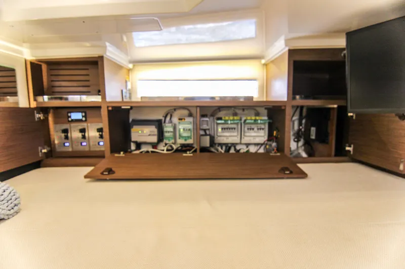 Slide: The Image of Interior view of 2021 Jeanneau Leader 12.5 WA yacht's control panel and storage area. - 53