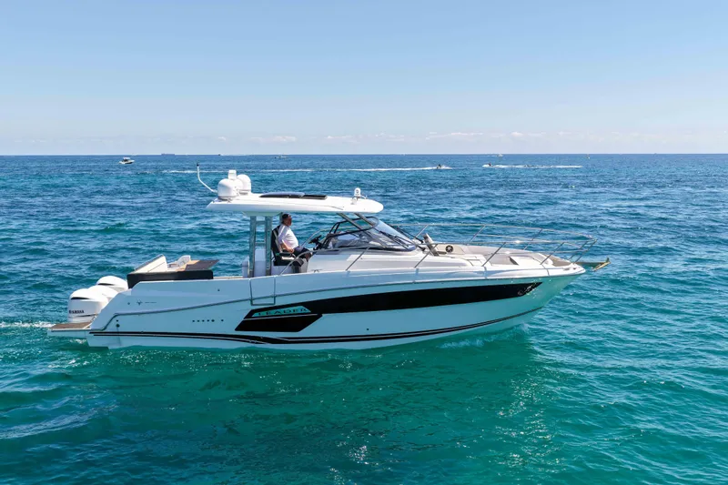 Slide: The Image of 2021 Jeanneau Leader 12.5 WA cruising on clear blue ocean waters. - 6