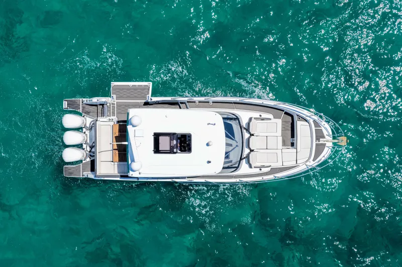 Slide: The Image of Aerial view of 2021 Jeanneau Leader 12.5 WA yacht on turquoise water. - 8