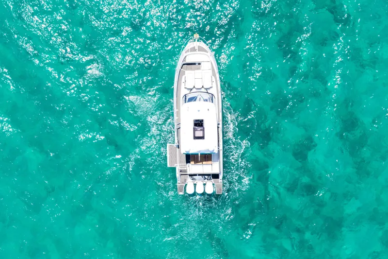Slide: The Image of Aerial view of 2021 Jeanneau Leader 12.5 WA yacht on turquoise water. - 9